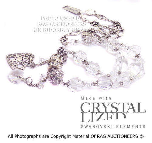 **R800** Swarovski Crystals and Quartz Necklace With Heart Tassels