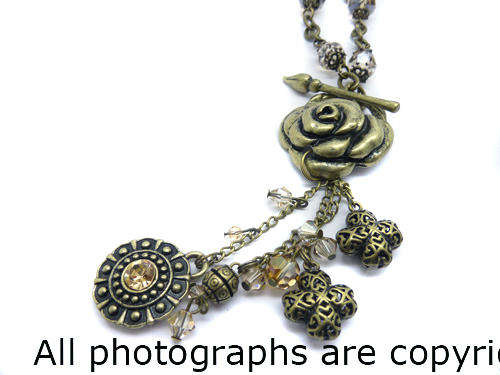 **R890** GENUINE SWAROVSKI and Tasseled Rose Medallion