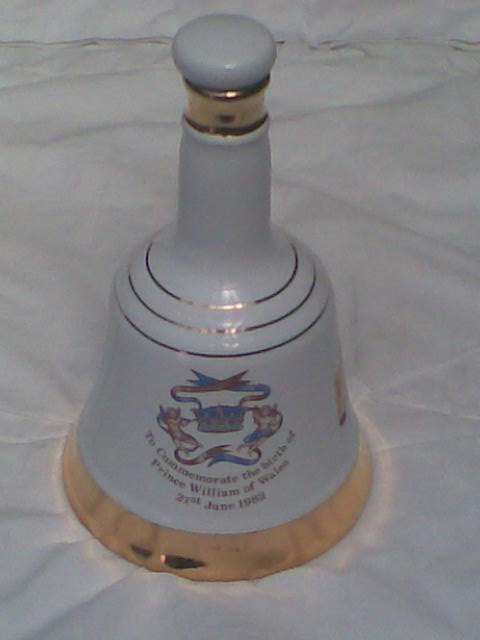 A WADE COMMEMORATIVE PORCELAIN DECANTER FROM BELLS SCOTCH WHISKEY TO COMMEMORATE THE BIRTH OF PRINCE