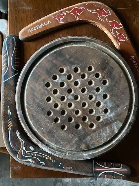 Old Wooden board game plus 2 boomerangs; one from Queensland Australia