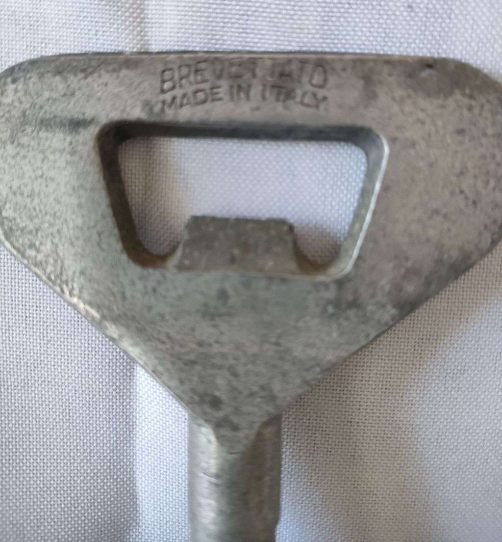 Very Collectable Italian corkscrew with makers mark and a brass bottle opener