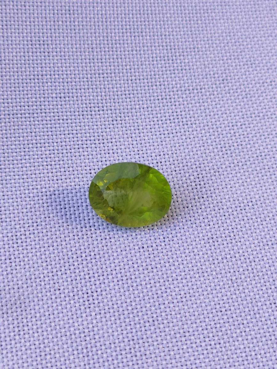 Peridot: - 10 x 8 x 5.25 mm natural mined oval cut stone - 3.02 ct - certification available at R250