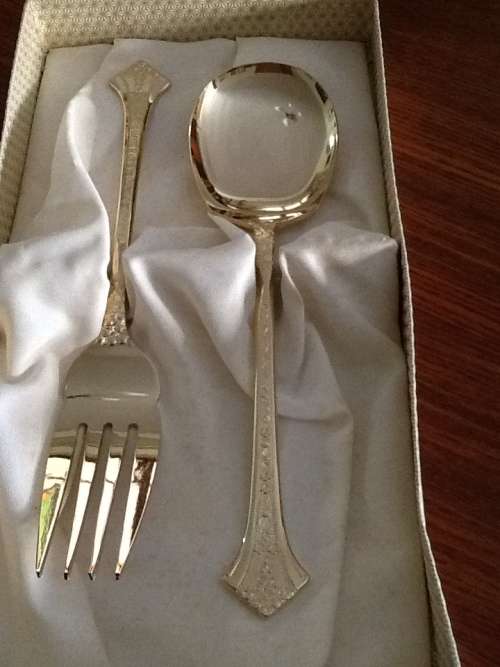 Genuine vintage 24ct goldplated serving spoons in pristine condition.