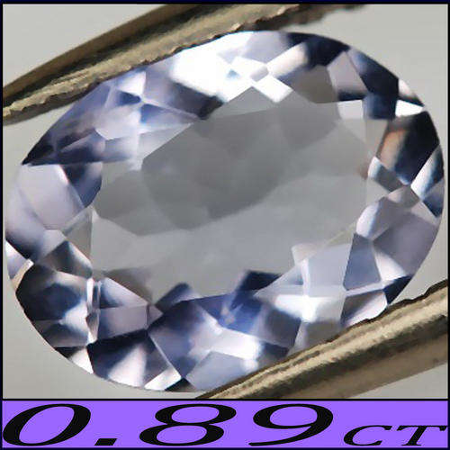 0.89 CT NATURAL VIOLET BLUE TANZANITE GEMSTONE WITH SPARKLING FIRE, POLISHED IN A PRETTY OVAL.