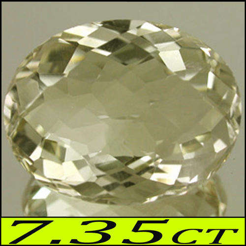 7.35 CT LOVELY NATURAL LIGHT YELLOW LEMON CITRENE GEMSTONE POLISHED IN AN OVAL CHECKERBOARD.