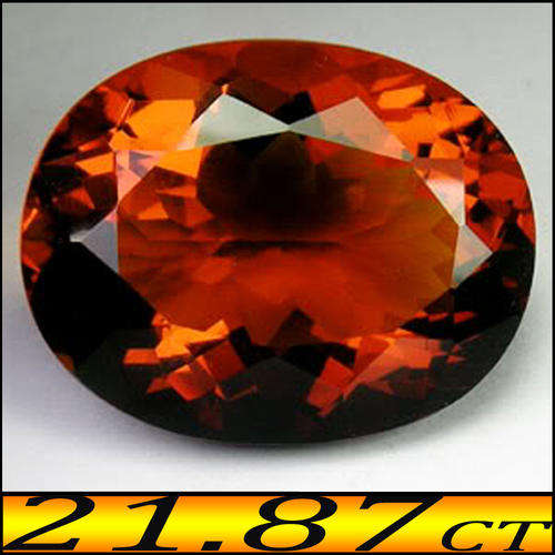 21.87 CT NATURAL IMPERIAL GOLDEN ORANGE CITRINE GEMSTONE POLISHED IN A BRILLIANT OVAL.
