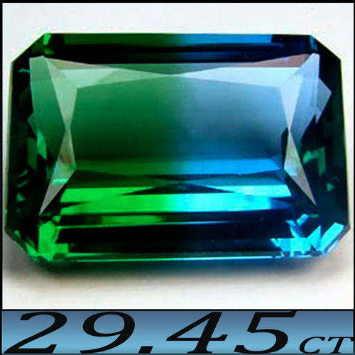 29.45 CT RARE LIGHT BLUE TO DEEP BLUISH GREEN POLISHED ELONGATED OCTAGON QUARTZ (HYDROTHERMAL) .