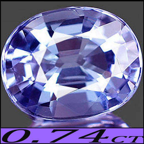 0.74 CT PERFECTLY POLISHED VIOLET TANZANITE GEMSTONE, A CLEAN MODERN OVAL RADIATING RED FIRE..