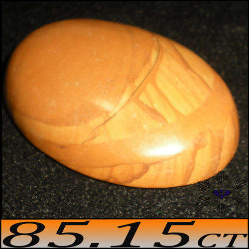 85.15 CT NATURAL OPAQUE LIGHT BROWN OAK AGATE GEMSTONE, POLISHED IN AN OVAL CABOCHON.