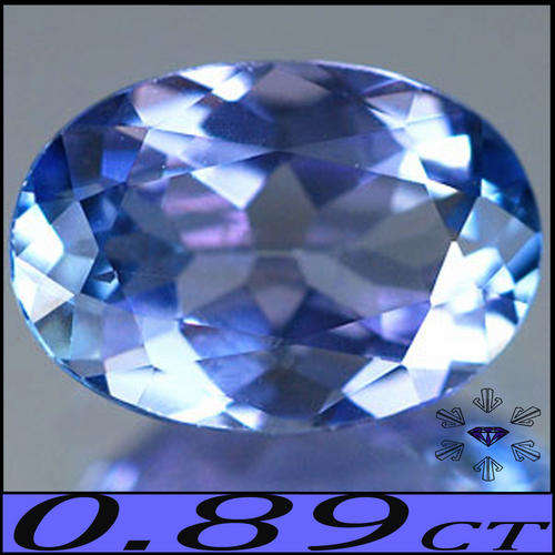 0.89 CT MAGICALLY CLEAN LUSTROUS OVAL VIOLET BLUE NATURAL TANZANITE, AWESOME REDDISH FIRE.