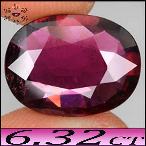 6.32 CT RARE RUBELITE TOURMALINE, A MULBERRY PINK OVAL POLISHED MADAGASCAN GEM.