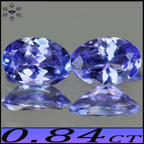 0.84CT TANZANITE PAIR [VS] - VIOLET BLUE OVAL GEMSTONES, WITH STUNNING LUSTER.