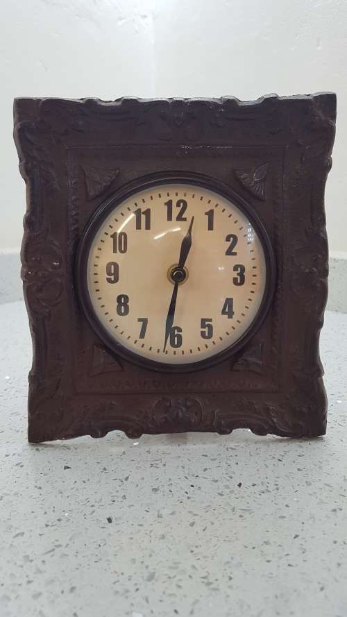 Stunning small cast iron mantel clock!