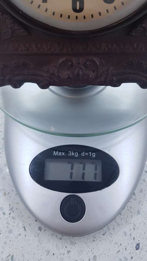 Stunning small cast iron mantel clock!