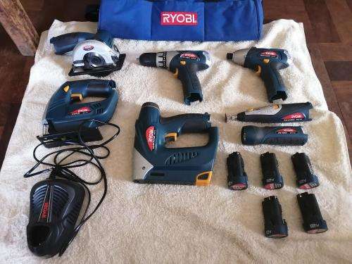 Ryobi Cordless Tools kit with 5 rechargeable batteries. In good condition with bag.