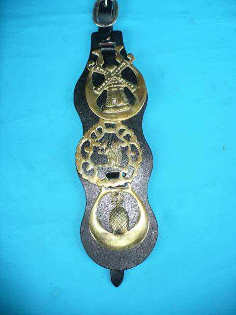 3 HORSE BRASSES ON BOARD WITH BUCKLE
