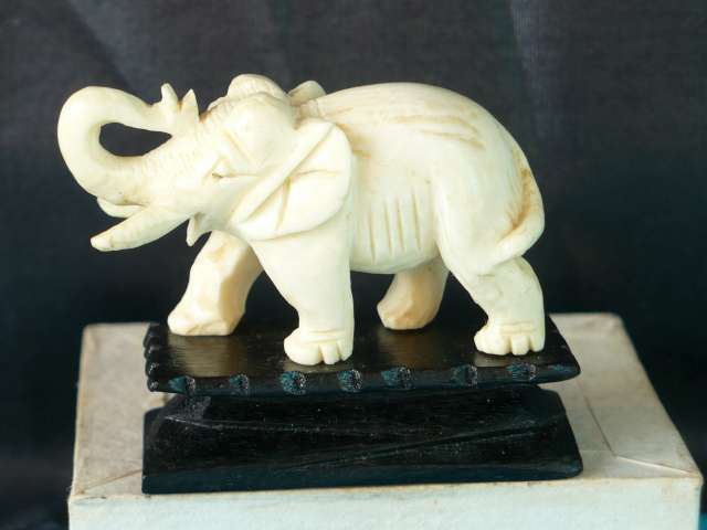 SMALL IVORY ELEPHANT ON STAND