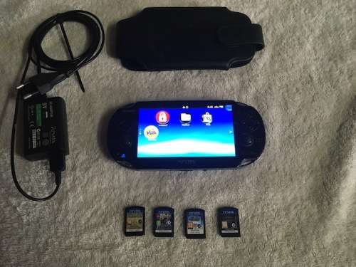PS Vita Console - with charger and games