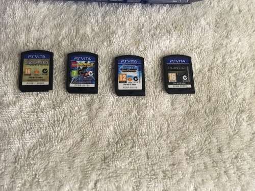 PS Vita Console - with charger and games