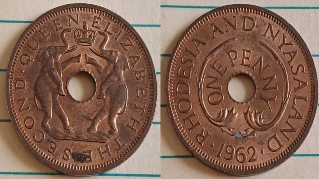1962 - Rhodesia and Nyasaland  - One Penny - AU/NC- Two elephants stand on hind legs -  Demonetised