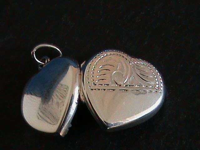 STERLING SILVER HEART SHAPE LOCKET...