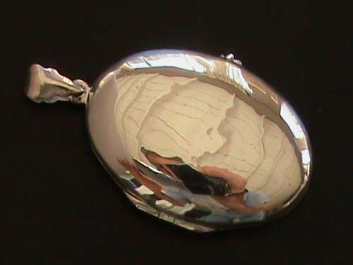 LARGE OVAL LOCKET.  SOLID STERLING SILVER