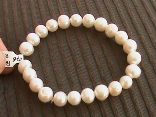 WHITE FRESHWATER PEARL BRACELET.   STRUNG ON ELASTIC