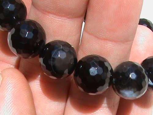 ONYX GEMSTONE BRACELET.  LARGE 12 MM FACETED BEADS.  STRUNG ON ELASTIC