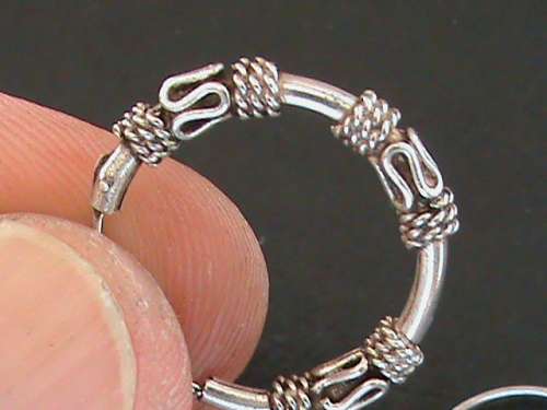 SOLID STERLING SILVER BALI TYPE SLEEPER EARRINGS.