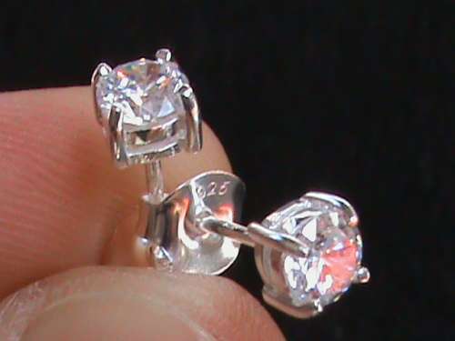 SOLID STERLING SILVER STUDS.  5 MM ROUND CZ STONES.