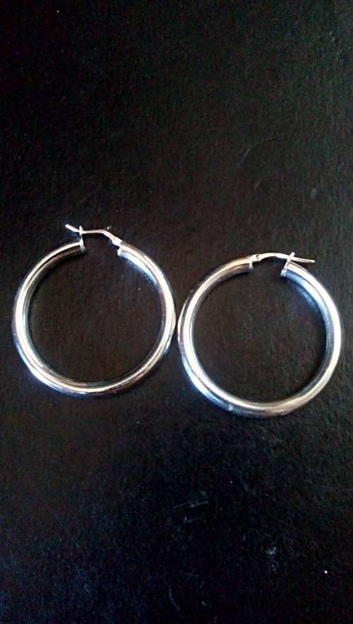 LARGE SOLID STERLING SILVER HOOP EARRINGS.