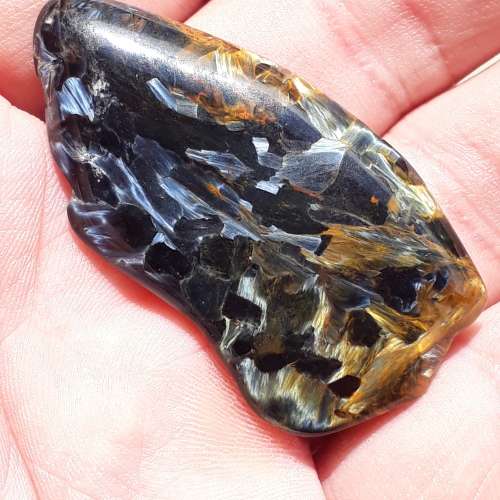 BLUE AND GOLDEN PIETERSITE.  NICE REFLECTIONS .