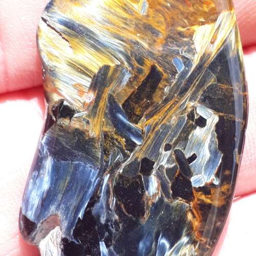 BLUE AND GOLDEN PIETERSITE.  NICE REFLECTIONS .