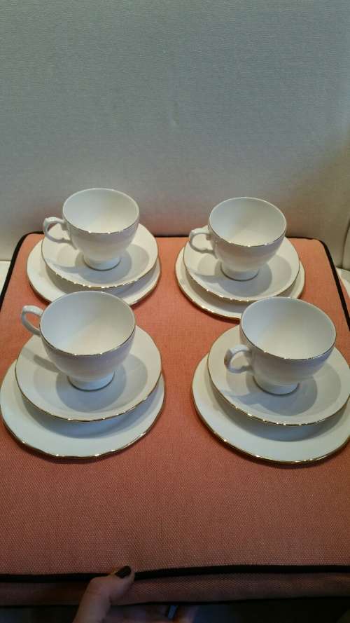 4 Queen Anne White and Gilt Trios and an extra Saucer
