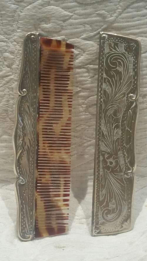 An 800 Silver Cased Comb with Tortoise Shell/Bakelite Bristles
