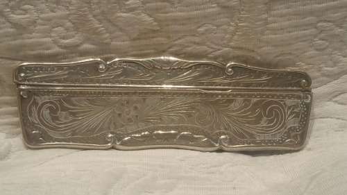 An 800 Silver Cased Comb with Tortoise Shell/Bakelite Bristles