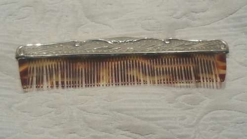 An 800 Silver Cased Comb with Tortoise Shell/Bakelite Bristles