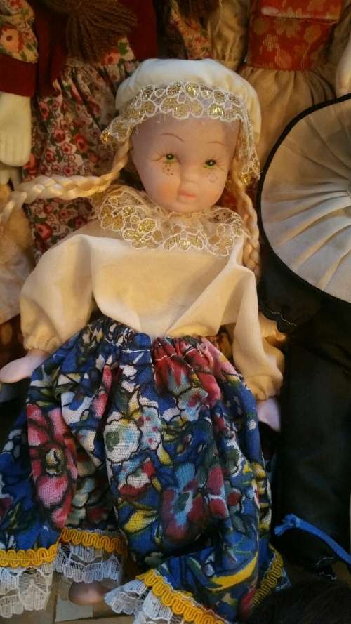 A Collection of 12 Vintage doll, 9 Porcelain and 3 Plastic