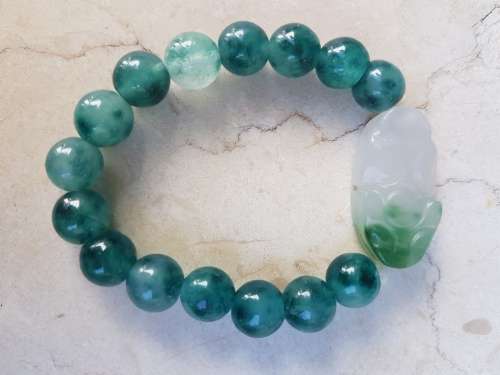 6 Jade Bracelets 3 green and 3 brown with Rabbit Motif, a symbol of longevity