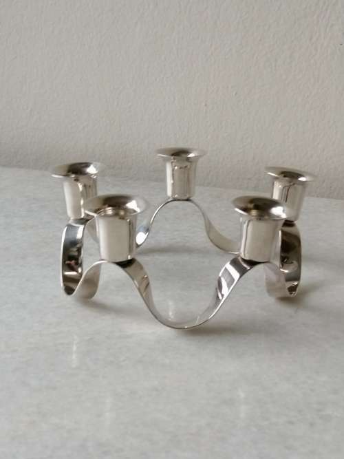 A Silver Plated Ribbon Styled Candleabra: 5 Candle