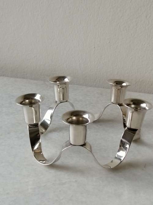 A Silver Plated Ribbon Styled Candleabra: 5 Candle