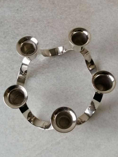 A Silver Plated Ribbon Styled Candleabra: 5 Candle