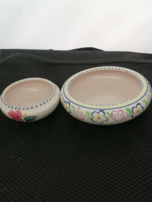 TWO POOLE TRINKET BOWLS ,ONE HAND DECORATED CICA 1952 AND THE OTHER SMALLER ONE CIRCA 1970