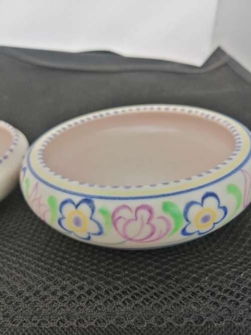 TWO POOLE TRINKET BOWLS ,ONE HAND DECORATED CICA 1952 AND THE OTHER SMALLER ONE CIRCA 1970