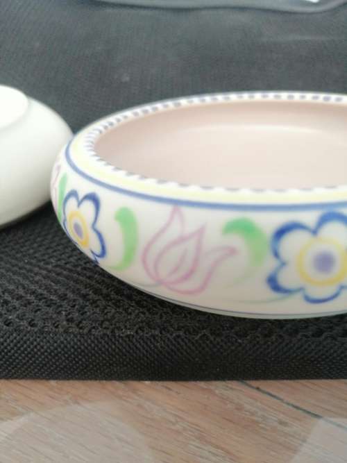 TWO POOLE TRINKET BOWLS ,ONE HAND DECORATED CICA 1952 AND THE OTHER SMALLER ONE CIRCA 1970