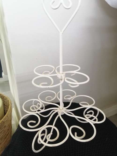 A PRETTY WHITE METAL CUPCAKE STAND