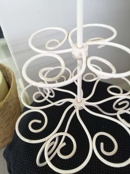 A PRETTY WHITE METAL CUPCAKE STAND