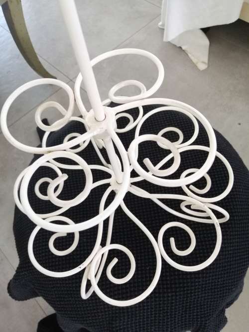 A PRETTY WHITE METAL CUPCAKE STAND