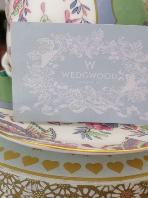A BOXED WEDGEWOOD`THE TEA STORY COLLECTION` NEVER USED CUP AND SAUCER