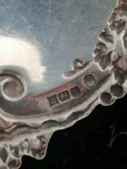 A HALLMARKED SILVER BRANDY DECANTER LABEL